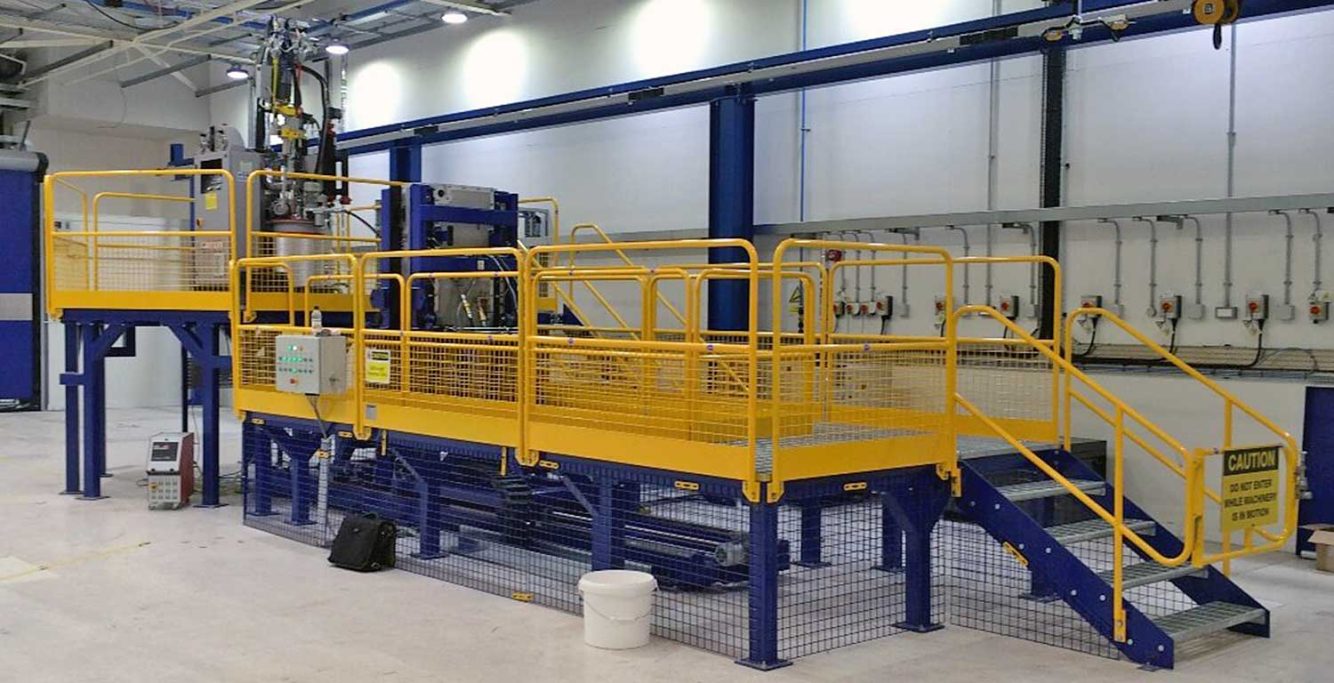 Fixed steel fabricated work station and platform with custom railings manufactured by Gateway Fabrications Hull, UK. Nationwide service. 