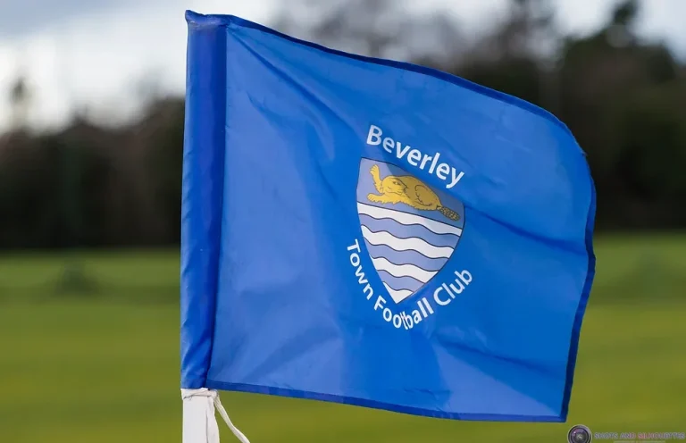 Blue flag with the Beverley Town Football Club logo and text.